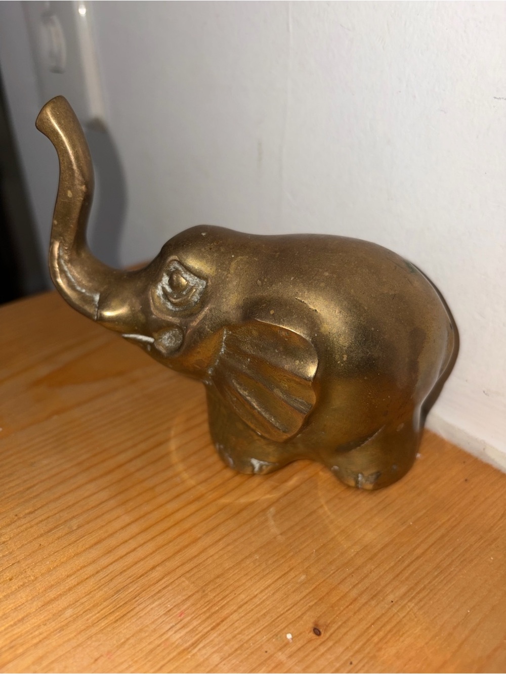 piece is a vintage statuette of a solid brass elephant